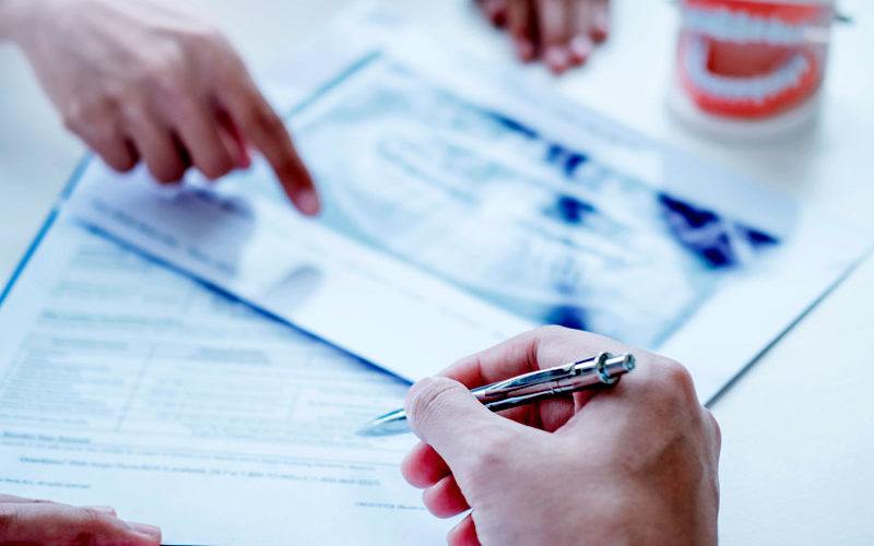 patient signing financial forms